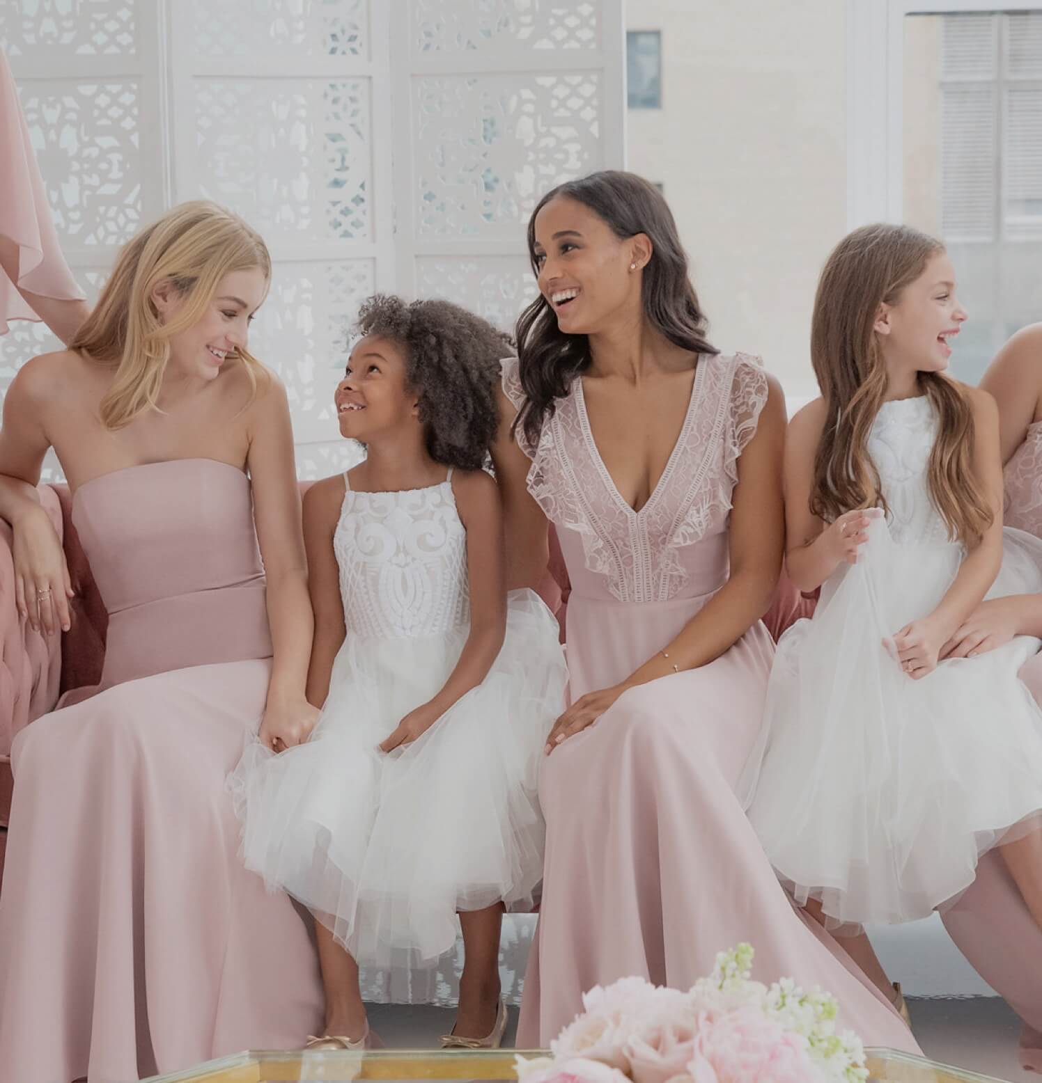 Bridesmaids in pale pink dresses