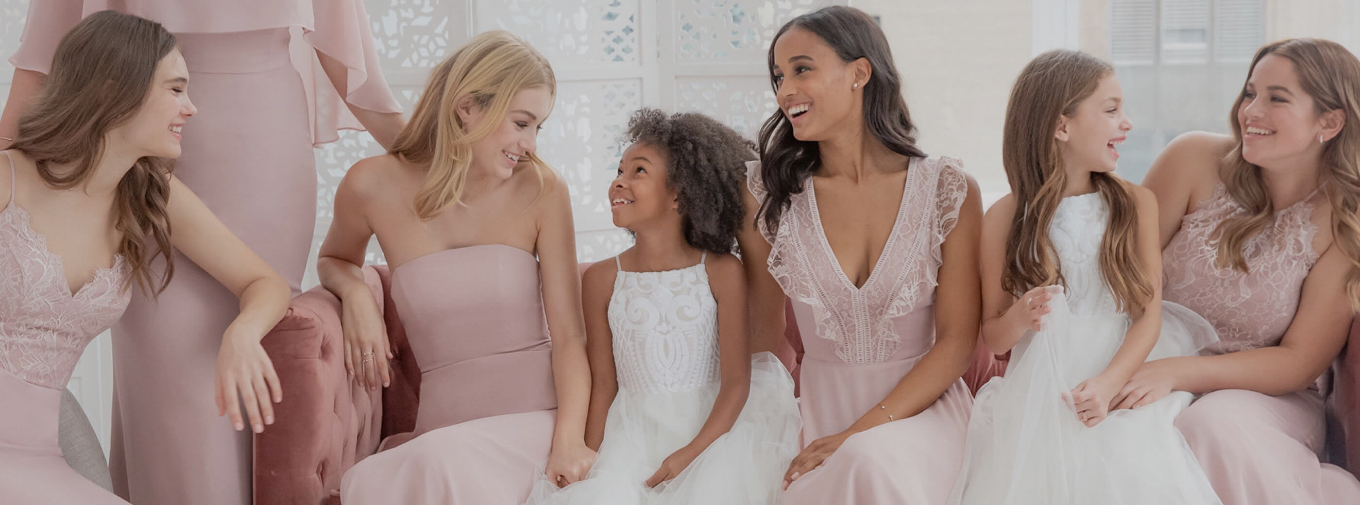 Bridesmaids in pale pink dresses